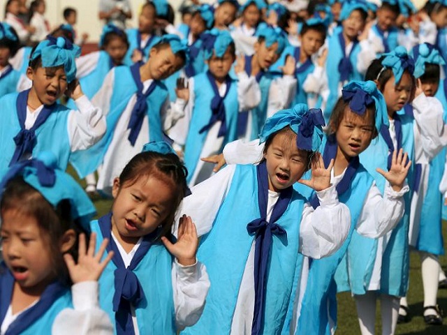 China formally approves three-child policy to prevent demographic crisis